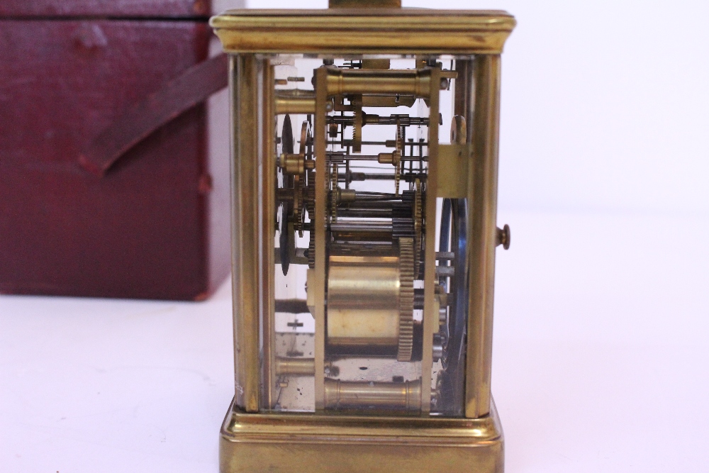 AN EARLY 20TH CENTURY BRASS CASED CARRIAGE CLOCK with white enamel dial and black Arabic numerals, - Image 4 of 5