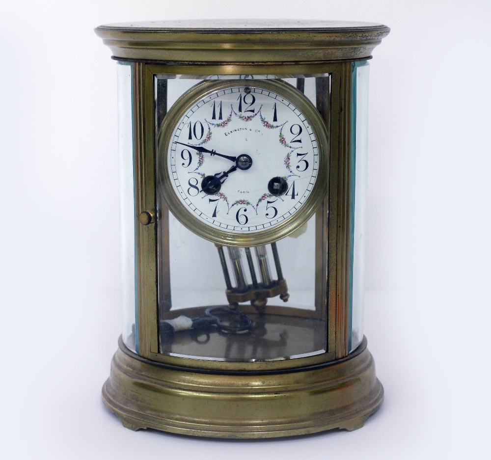 AN EARLY 20TH CENTURY FRENCH OVAL FOUR GLASS MANTLE CLOCK the dial signed 'Elkington & Co Paris',