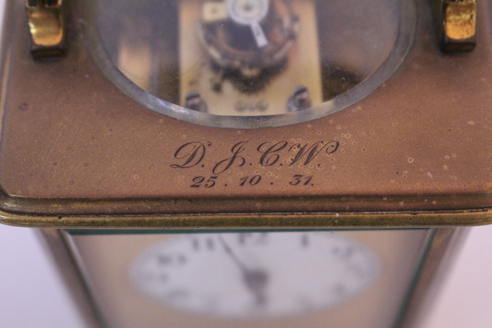 AN EARLY 20TH CENTURY BRASS CASED CARRIAGE CLOCK with white enamel dial and black Arabic numerals, - Image 2 of 5