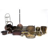 A QUANTITY OF BRASS AND COPPERWARE to include a pierced brass fender, a copper helmet shaped coal