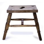 AN ELM STOOL marked 'Hazel, Oxford', 30cm wide x 29cm deep x 31cm high