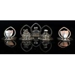 FIVE SILVER MENU HOLDERS on octagonal bases, with marks for Birmingham 1905, each 3.25cm wide (5)