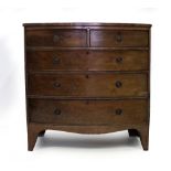 A 19TH CENTURY MAHOGANY CROSS BANDED TWO OVER THREE DRAWER CHEST with bow front standing on