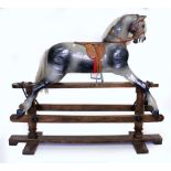 AN EARLY 20TH CENTURY GREY PAINTED ROCKING HORSE 125cm in length x 110cm high