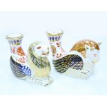 A GROUP OF FOUR ROYAL CROWN DERBY PORCELAIN CANDLESTICKS in the form of mystical creatures,