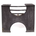 A CAST IRON BLACK PAINTED 18TH CENTURY STYLE FIRE GRATE with bow basket front and wreath decoration,