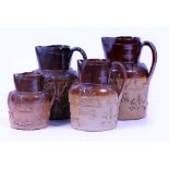 A GRADUATED SET of four 19th Century stoneware harvest jugs by J. Stiff & Sons, Lambeth, the largest