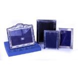 TWO CARRS SILVER PICTURE FRAMES the largest 18cm x 22cm, two further silver picture frames (4)