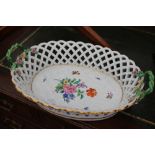 A MEISSEN PORCELAIN OVAL BASKET decorated with flowers (damages) 42cm wide overall