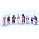 A COLLECTION OF BESWICK ORNAMENTS to include animal pig band to include Michael, James, Matthew,