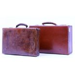 TWO OLD LEATHER SUITCASES the largest 48cm wide (2)