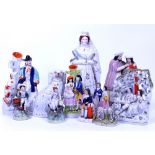 TWELVE STAFFORDSHIRE FIGURES to include a figure of Queen Victoria, one of a courting couple, one