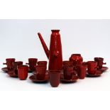 A RED GLAZED STUDIO POTTERY TEASET with indistinct monogram 'D.R'? consisting of a coffee pot,