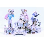 A GROUP OF EIGHT CONTINENTAL PORCELAIN FIGURINES to include a pair of Meissen porcelain children