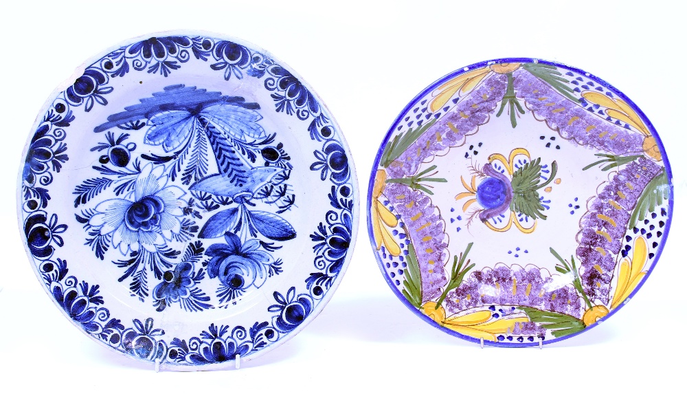 TWO TIN GLAZED DISHES the largest 36cm diameter