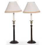 A PAIR OF GEORGIAN STYLE HARDWOOD TABLE LAMPS with fluted stems and circular spreading bases 65cm