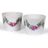 A PAIR OF BERLIN PORCELAIN JARDINIERES decorated with trailing rose swags and with underglazed