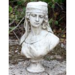 A CAST RECONSTITUTED STONE BUST of a girl wearing a headress, 33cm wide x 55cm high