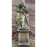 A CAST CONCRETE STATUE OF TWO LOVERS 73cm high together with a cast concrete plinth base with