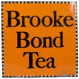 AN EARLY TO MID 20TH CENTURY ENAMEL BROOKE BOND TEA SIGN with black and white checkered border,