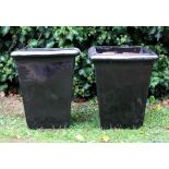 A PAIR OF BLACK GLAZED TERRACOTTA SQUARE SECTION TAPERING PLANTERS 40cm wide x 46cm high (2)