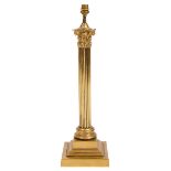 AN ANTIQUE BRASS OIL LAMP BASE by J Hinks & Son Limited, in the form of a Corinthian column with