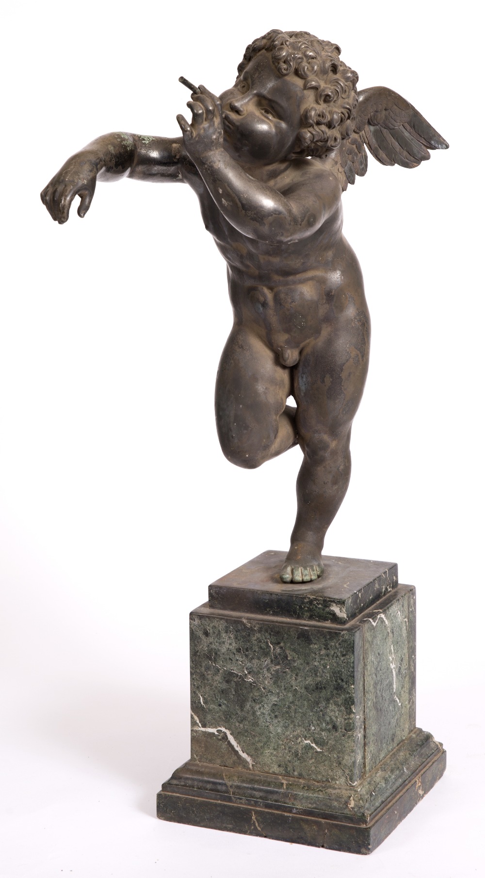 A 19TH CENTURY BRONZE SCULPTURE of Cupid blowing bubbles, mounted on a green marble plinth base 66cm