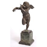 A 19TH CENTURY BRONZE SCULPTURE of Cupid blowing bubbles, mounted on a green marble plinth base 66cm