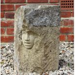 A CARVED SCULPTURE OF A GIRL'S FACE within a roughcut piece of stone, 25cm wide x 18cm deep x 45cm