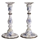 A PAIR OF 18TH CENTURY BILSTON ENAMEL CANDLESTICKS decorated with blue flowers on a white ground and