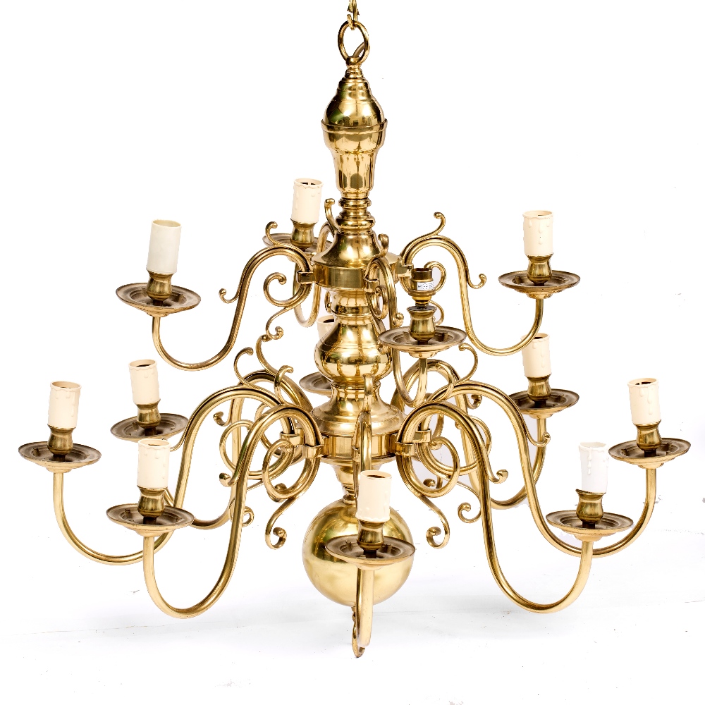 A 17TH CENTURY DUTCH STYLE BRASS TWELVE LIGHT CHANDELIER with scrolling branches, 82cm high x 82cm