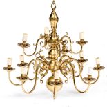 A 17TH CENTURY DUTCH STYLE BRASS TWELVE LIGHT CHANDELIER with scrolling branches, 82cm high x 82cm