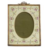 A 19TH / 20TH CENTURY GILT METAL MOUNTED RECTANGULAR PHOTOGRAPH FRAME with ribbon tied crest and