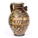 AN ITALIAN MAIOLICA TIN GLAZED WET DRUG JAR with a spout and looping handle and labelled ACQA.