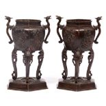 A PAIR OF ORIENTAL BRONZE TWIN HANDLED SENSORS with lion mask decorated handles, decorative