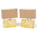 A PAIR OF CONTEMPORARY GLASS PERSPEX AND GOLD LEAF RECTANGULAR TABLE LAMPS with matching shades,