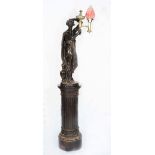 A REGENCY BRONZED PLASTER LAMP in the form of a classical female figure, the brass lamp stamped M.