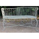 A GREEN PAINTED WIREWORK CONVERSATION SEAT 116cm wide x 50cm deep x 72cm high