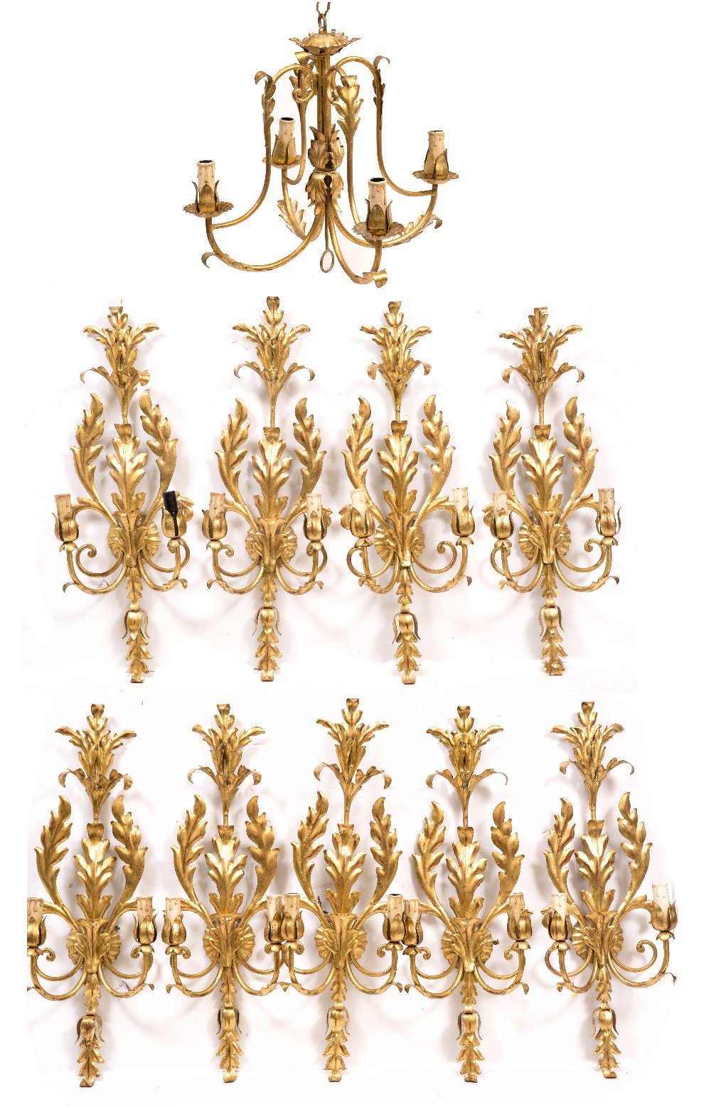 NINE CONTEMPORARY GILDED WALL LIGHTS with scrolling acanthus leaves and faux wax fittings 64cm