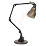 AN INDUSTRIAL WORKBENCH LIGHT or table lamp with jointed arm and painted spun aluminium shade 70cm