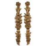 A PAIR OF MID 20TH CENTURY ITALIAN CARVED AND GILT WOODEN HANGING ORNAMENTS in the form of floral