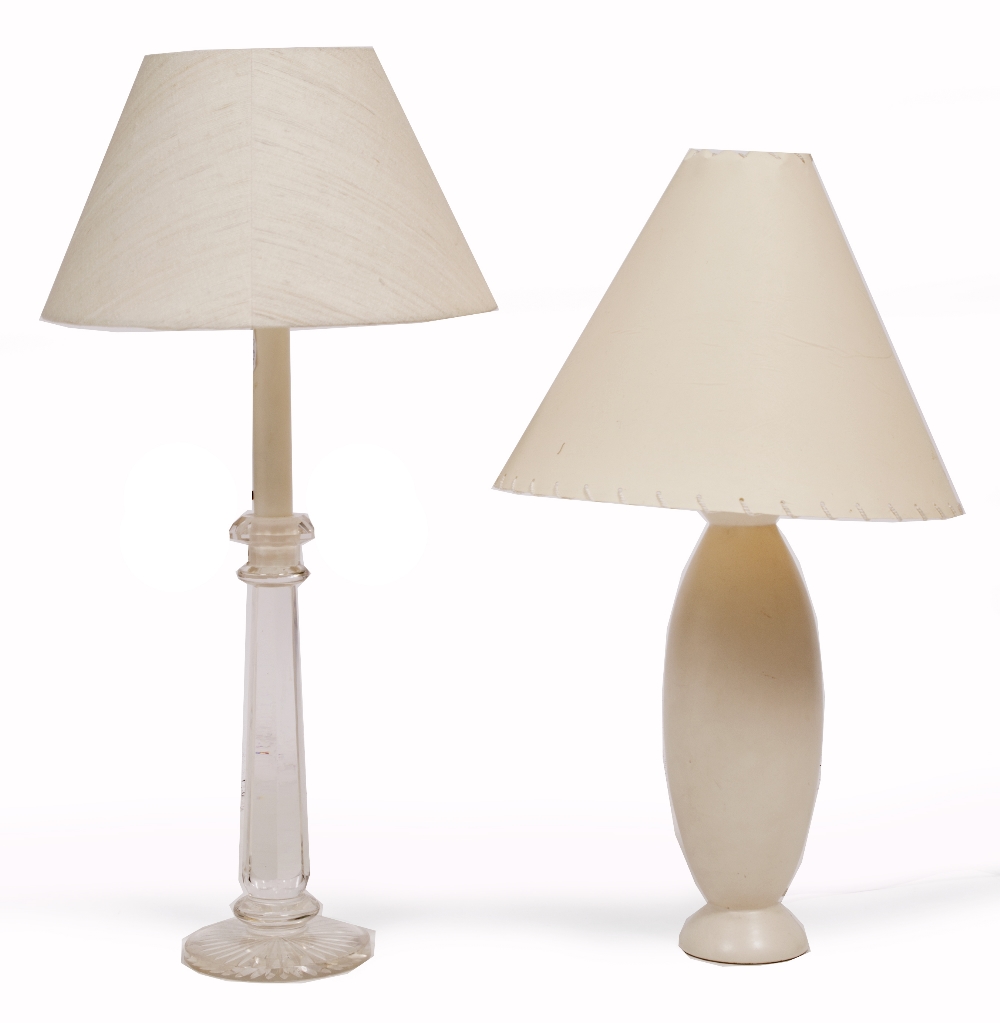 A CUT GLASS TABLE LAMP with faceted stem and circular spreading base together with a white pottery