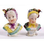 A PAIR OF LATE 18TH OR EARLY 19TH CENTURY PORCELAIN BUSTS of young girls, each with ribbon tied