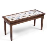 A LOW RECTANGULAR HARDWOOD OCCASIONAL TABLE inset with 12 Dutch Delft tiles, some blue and white,