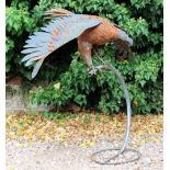 A CONTEMPORARY WROUGHT METAL SCULPTURE OF AN EAGLE on perch 98cm high approximately overall x