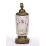 A 19TH CENTURY ENAMEL DECORATED TABLE LAMP with cast brass mounts, originally an oil lamp and now