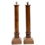 A PAIR OF TURNED OAK TABLE LAMPS of column form on square spreading bases 86cm high