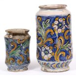 AN ITALIAN 17TH CENTURY TIN GLAZED CYLINDRICAL DRUG JAR decorated with flowers, 17cm diameter x 32cm