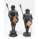 A PAIR OF PRESSED METAL MODELS of Maltese Knights in armour with painted shields, 27cm high