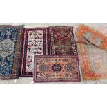 A GROUP OF FIVE RUGS to include one decorated with chickens, the largest 337cm x 118cm (5)